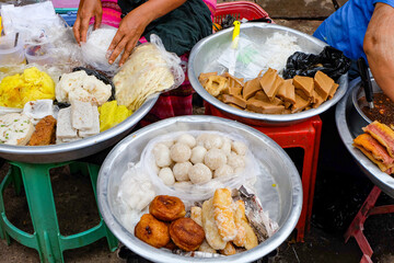 Burmese traditional street food, snacks and sweets at a fresh market and street vendors
