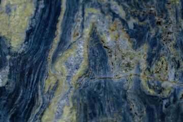Abstract stone background. Close up of a naturally formed colorful rock with textures and patterns