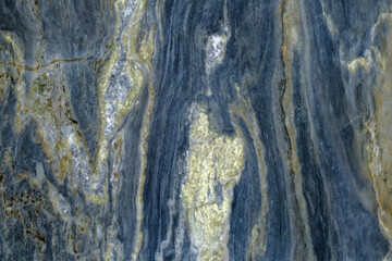 Abstract stone background. Close up of a naturally formed colorful rock with textures and patterns