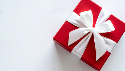 Red gift box with white ribbon. Present for wedding, birthday or anniversary.