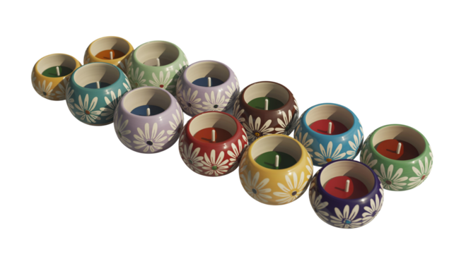 Set of colorful hand-painted ceramic tea light holders arranged in a group, with candles inside
