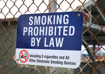 no smoking metal sign in the park