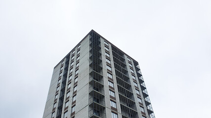 Construction of a brick apartment building in the city. Brick apartment building. Modern real estate. Apartment, ownership, rental.