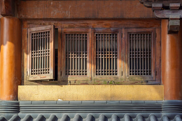 Ancient China natural wood window and Decoration colorful painting beam and wood pole, Beijing city, China