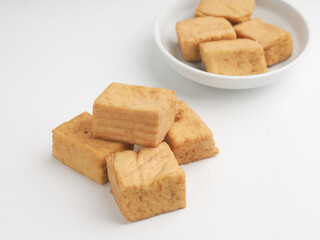Tofu on a plate, on white background