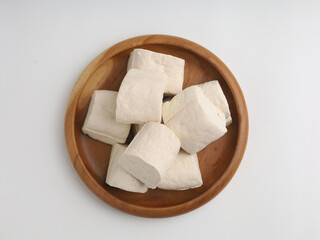 Tofu on a plate, on white background