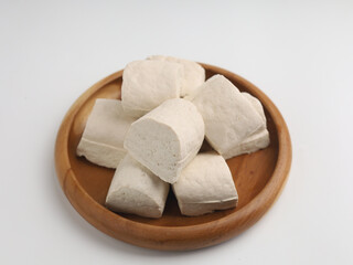 Tofu on a plate, on white background