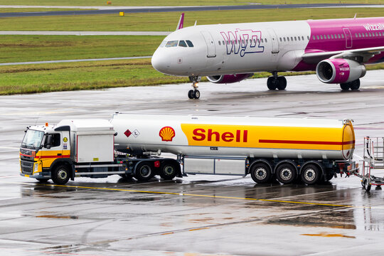 Volvo fuel truck Shell kerosine refueling vehicle driving on the apron of Eindhoven Airport.