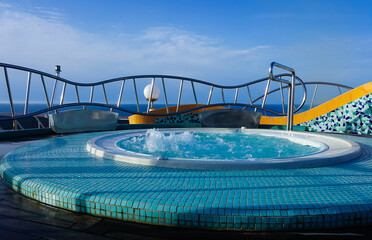 The jacuzzi at simming pool area on abstract cruise ship