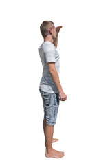 Young man full length side view portrait with hand to forehead looking far away in the distance isolated on transparent background