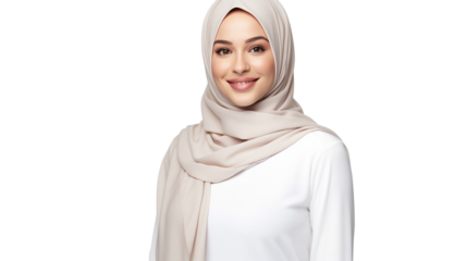 A beautiful young woman in hijab and smiling at the camera, isolated on transparent background. PNG