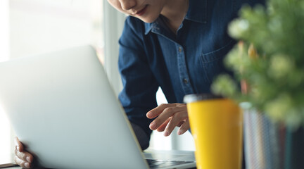 Business woman architect working on laptop for creating interior design project in studio office....