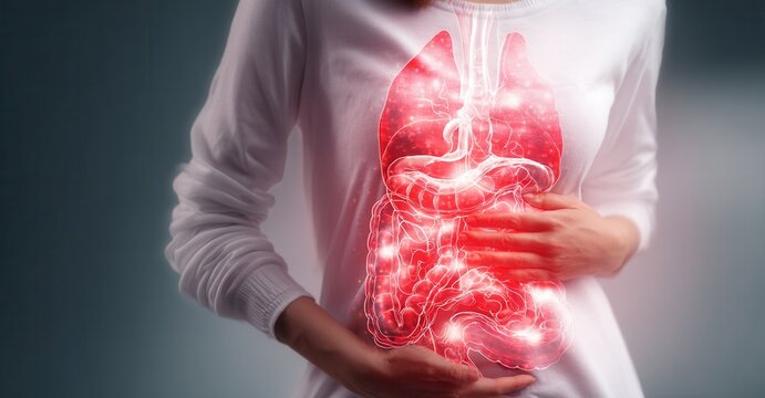 Digestive discomfort: An individual experiences pain in their abdomen, highlighted by a glowing anatomical illustration of the digestive system.