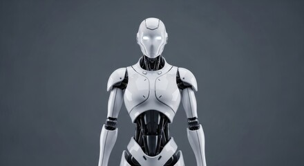 Fototapeta premium A humanoid robot with a sleek, white exterior and black mechanical joints stands against a gray background. The design is futuristic and emphasizes technology.