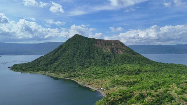 Aerial view of the landscapes surrounding Taal Volcano and Binintiang Malaki mountain in Tagaytay, Philippines - featuring mountains, lake, and scenic natural beauty in 4K resolution