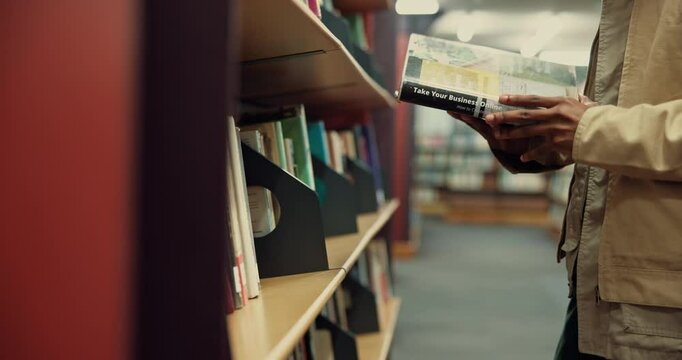 Student, hands or book at bookshelf in library for test preparation, exam knowledge or information. University, person and search course resources for thesis citation, literature reading or education