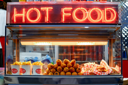 hot food at fair show, fried fast food, junk hotbox, chips fries, dagwood dog corndog, greasy unhealthy, obesity overweight, western diet