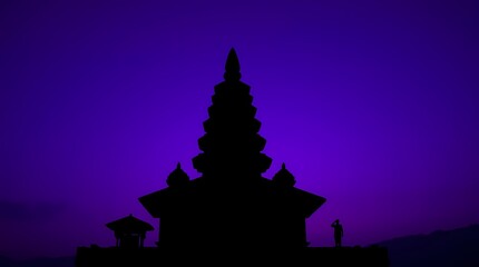 Silhouette of ancient temple at twilight