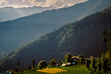 Mountain landscape in the morning. Pundarik Rishi Temple, Upper Neahi village. Sainj Valley, Eco Zone, Great Himalayan National Park, Himachal Pradesh, India.