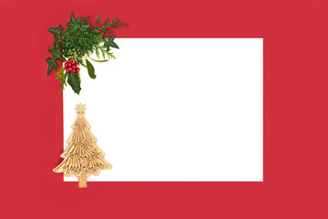 Gold Christmas tree decoration of winter greenery flora, holly berries, mistletoe, ivy, fir on...