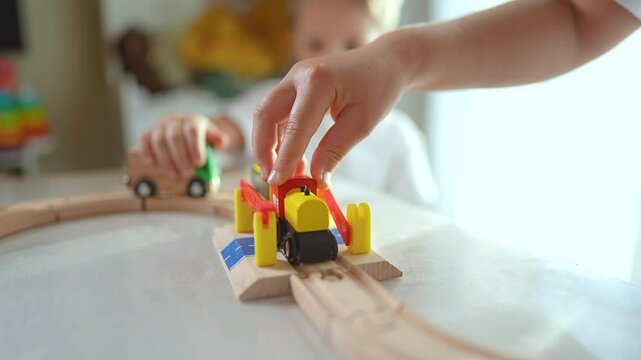 Children play with wooden locomotive at home. hands guiding locomotive. Kids enjoy imaginative play indoors. Fun childhood moments as children play locomotive. playtime with children locomotive set.