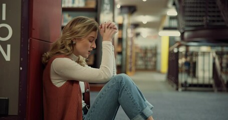 Stress, student and woman with anxiety in library, exam pressure or fail test in college. University, sad or unhappy girl overwhelmed with assignment deadline, burnout or think with worry for results