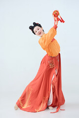 Beautiful dancers wearing ancient Tang Dynasty costumes and makeup performing classical dance
