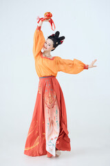 Beautiful dancers wearing ancient Tang Dynasty costumes and makeup performing classical dance