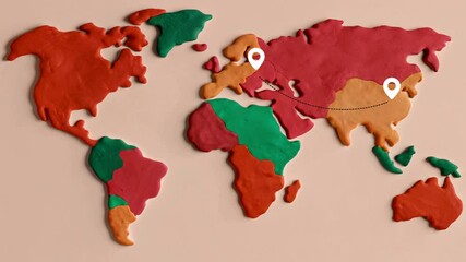 Playful Clay Model World Map with Pins in Asia and Europe, Red and Green, Geographical Representation words + concept