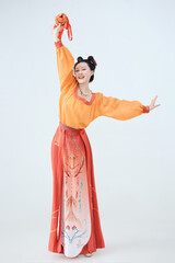 Beautiful dancers wearing ancient Tang Dynasty costumes and makeup performing classical dance