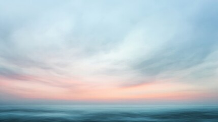 Obraz premium Blurred seascape with pastel colors showing sky water and horizon.