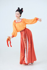 Beautiful dancers wearing ancient Tang Dynasty costumes and makeup performing classical dance