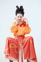 Beautiful dancers wearing ancient Tang Dynasty costumes and makeup performing classical dance