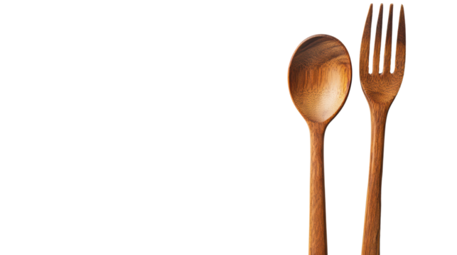 Wooden spoon and fork on isolated background, perfect for kitchen and dining themes.