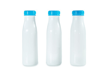 Three white plastic bottles from dairy products.