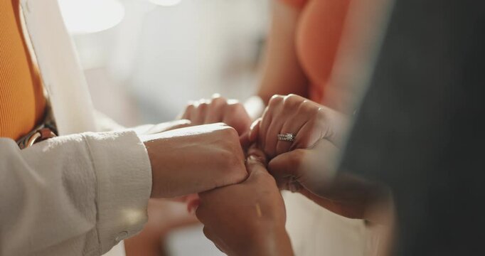 Praying, group and holding hands for faith, church or closeup of Christian friends, unity or belief. Worship, together and people with comfort for bible study, religion and respect for Jesus Christ