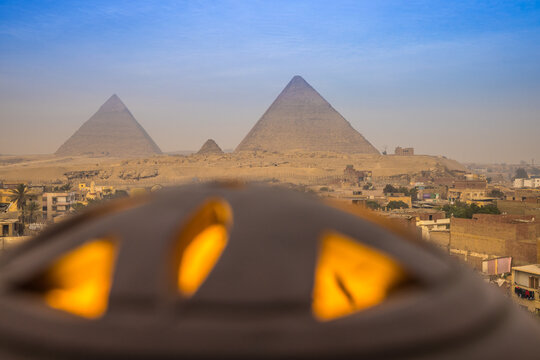 Pyramids in Giza, Egypt and a lantern looking like a UFO