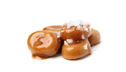 Tasty sweet candies, salt and caramel sauce isolated on white