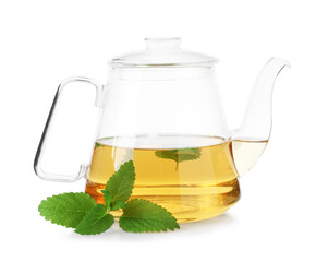 Aromatic lemon balm tea in glass teapot and fresh leaves isolated on white