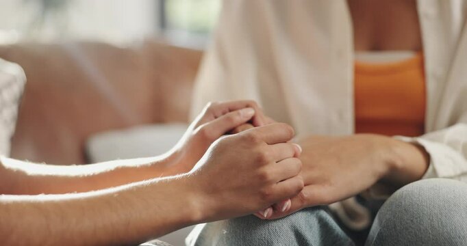 Friends, holding hands and consoling in home, trust and compassion for woman with grief and helping. House, care and patience for person in living room, empathy or understanding of trauma or kindness