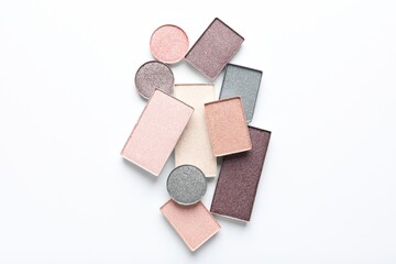 Beautiful eye shadow refill pans on white background, flat lay