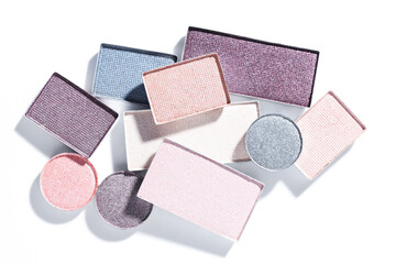 Beautiful eyeshadow refill pans on white background, flat lay
