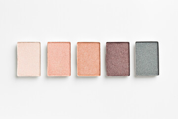 Beautiful eyeshadow refill pans on white background, flat lay