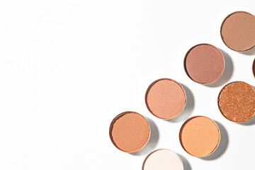Beautiful eyeshadow refill pans on white background, flat lay. Space for text