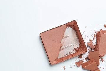 Broken eyeshadow refill pan on white background, top view. Space for text