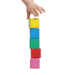 Child playing with colorful cubes on white background, closeup