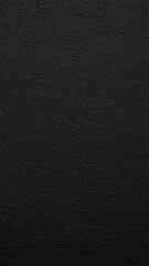 Fototapeta premium Black rough paper texture, close view paper pattern background