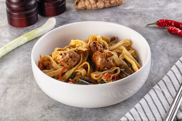 Asian cuisine udon with chicken and vegetables