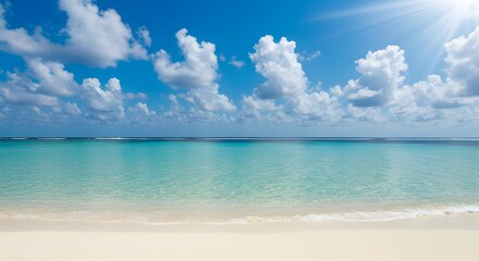 Obraz premium Calm beach with white sand, turquoise water and clouds