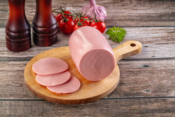 Boiled sausage with slices for breakfast © Andrei Starostin